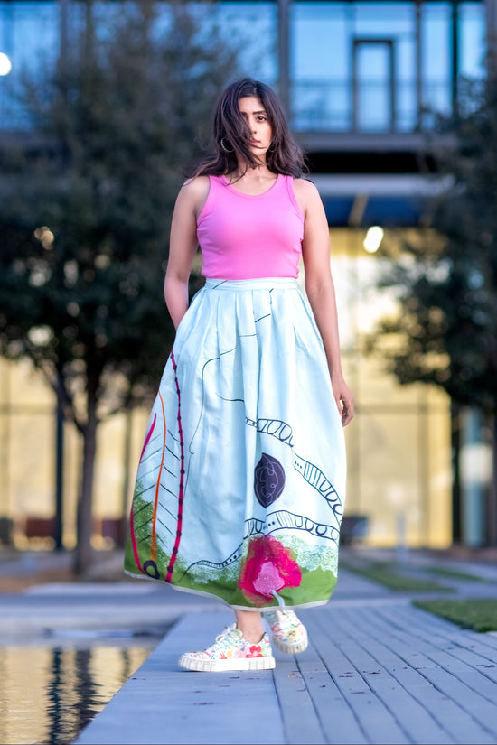 Designer silk box pleat skirt in powder blue with abstract wearable art print by Ojasi