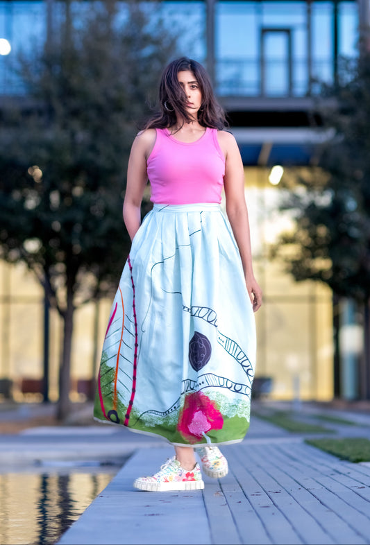 Designer silk box pleat skirt in powder blue with abstract wearable art print by Ojasi