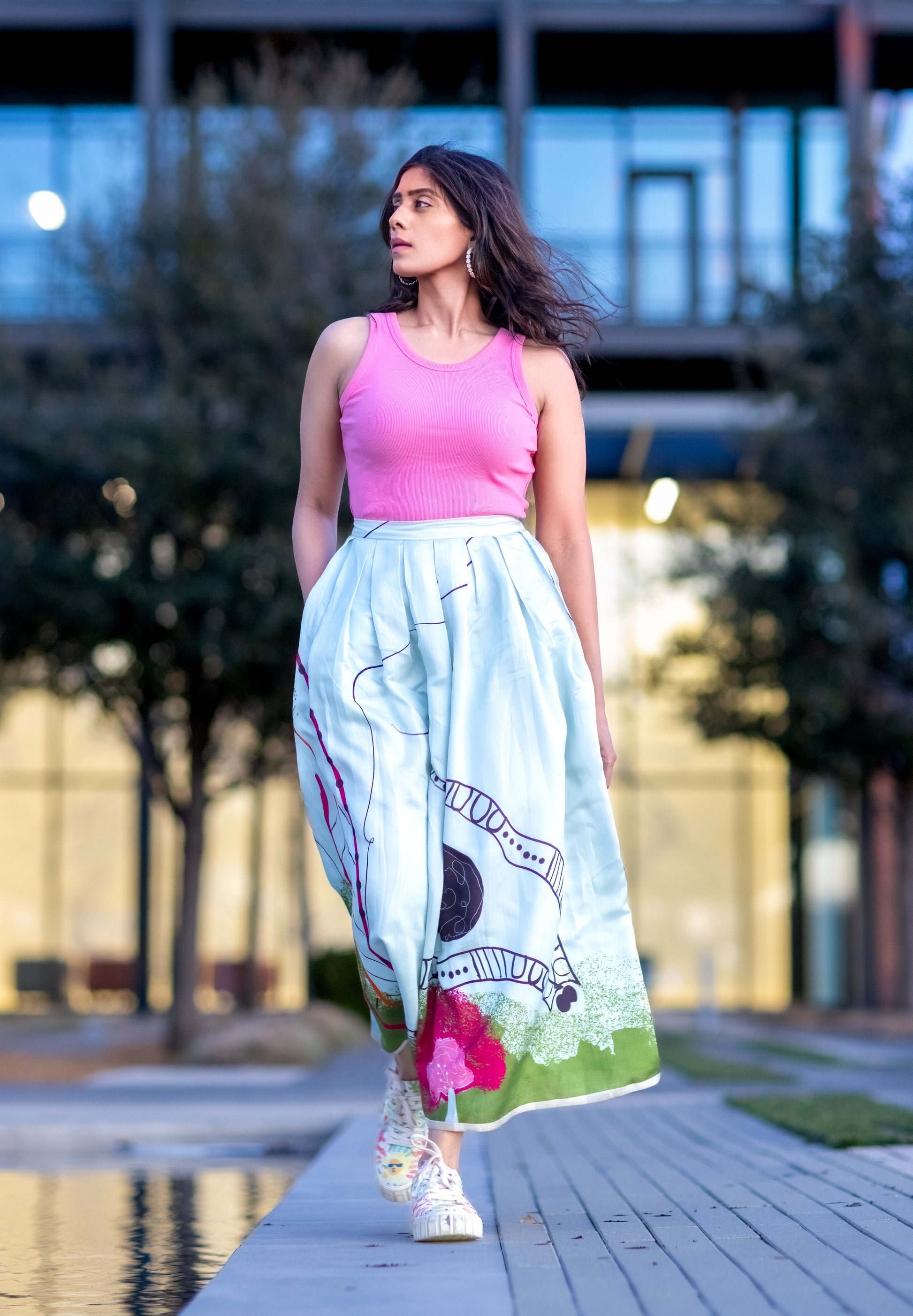 Powder blue silk midi skirt with structured box pleats and fluid movement