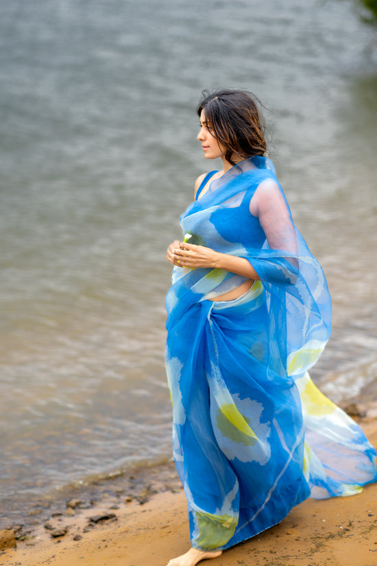 model walking by lake in high end premium editorial abstract saree in Texas