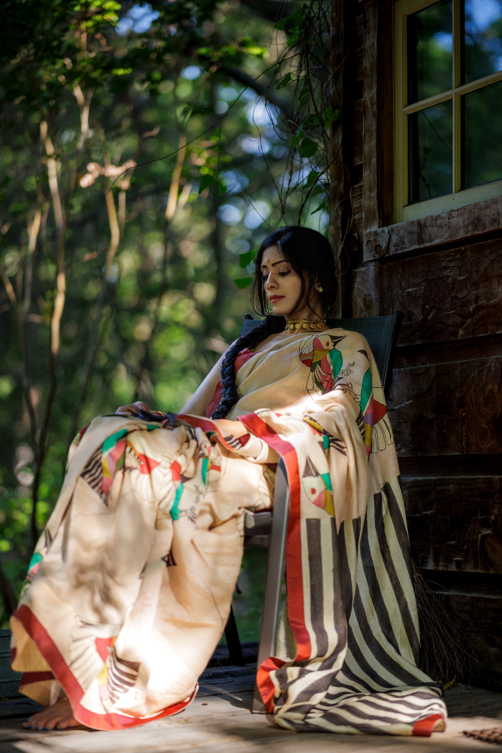 A woman wearing MUKTA handpainted kalamkari saree designed by Ojasi Design studio