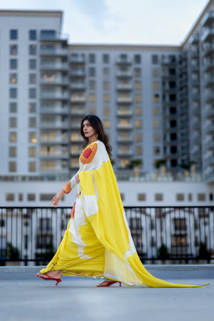 Woman in Lemon yellow flowy luxury designer saree USA