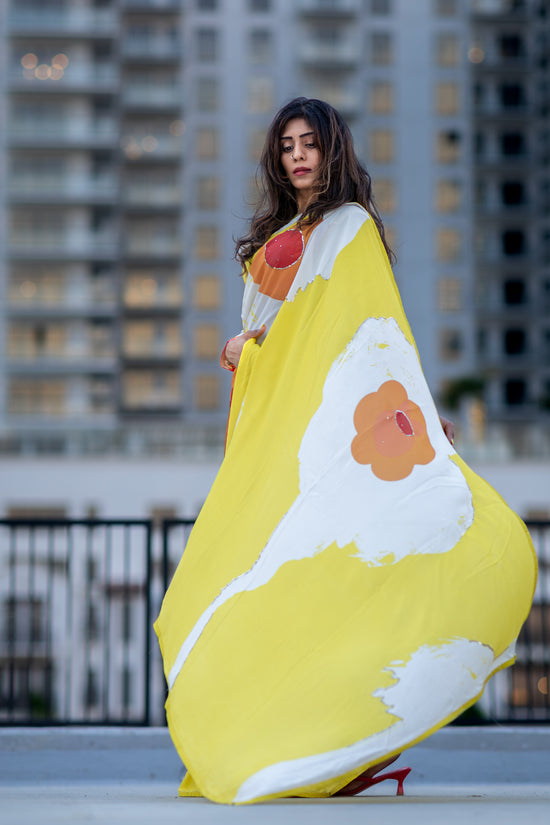 Model posing in Digitally printed georgette saree by Indian designer Ojasi in USA