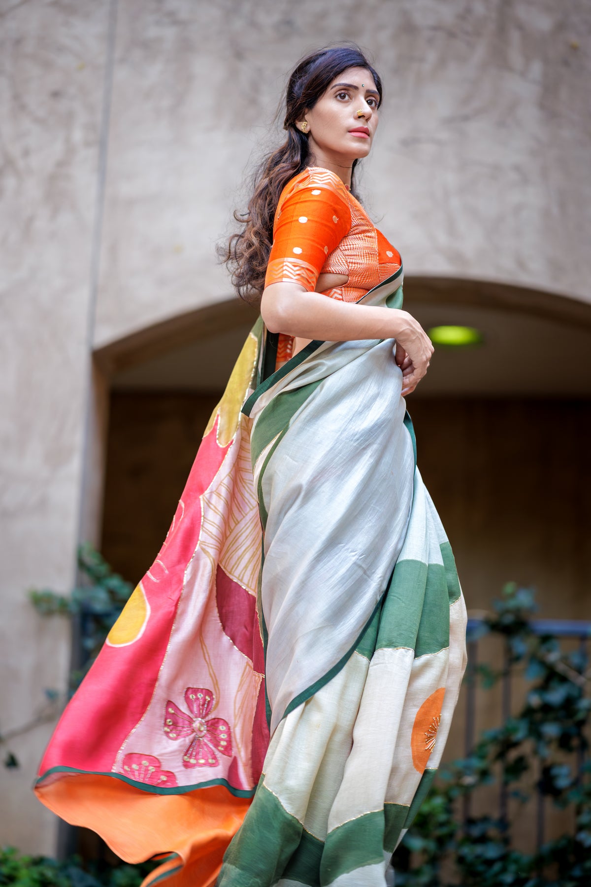 south asian Indian model wearing authentic pen kalamkari saree handpainted and hand embroidered using sequin and pitta work