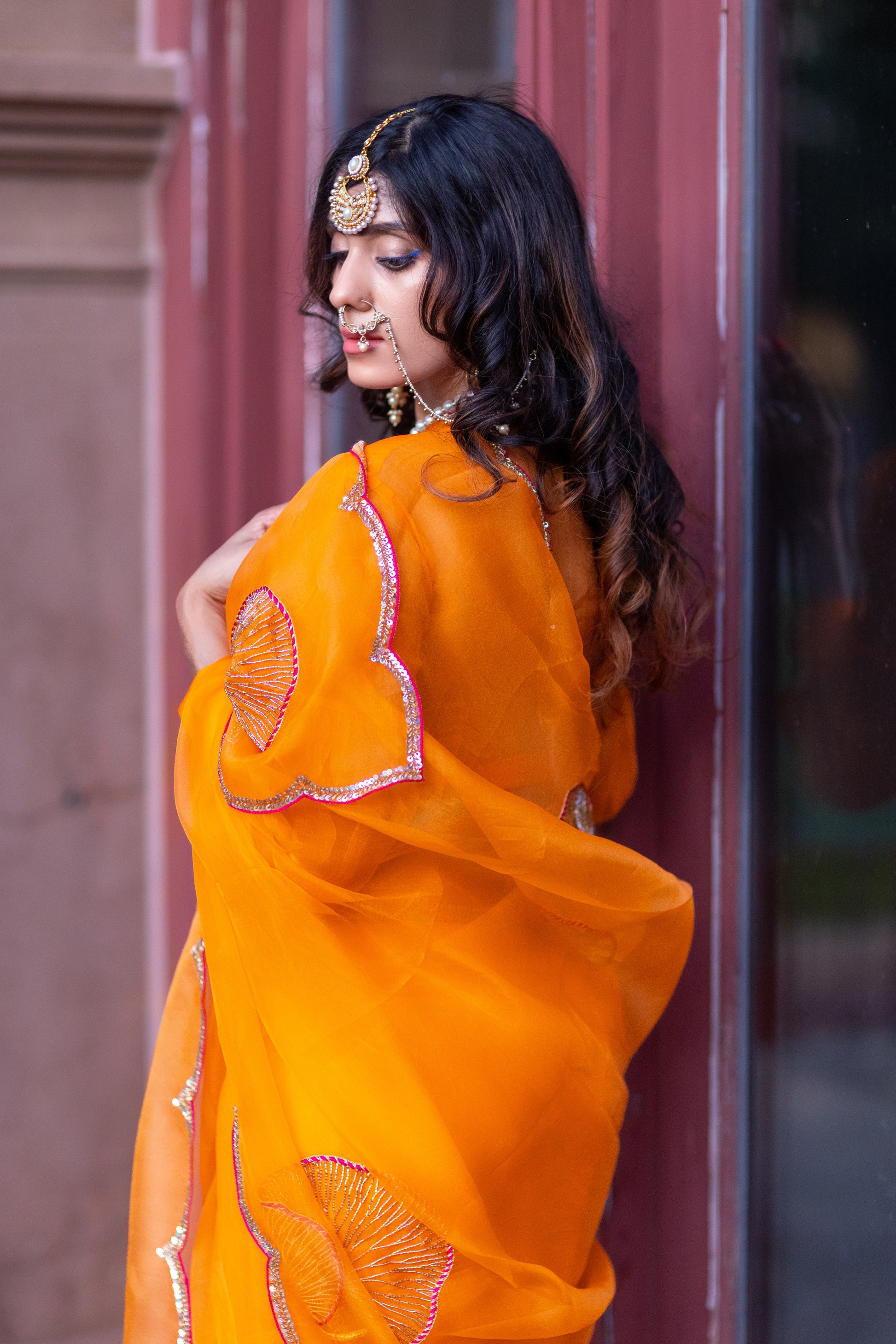 Tamara – Sunkissed Orange Pure Organza Silk Saree with Hand-Embroidered Lotus Leaves & Sequin Pallu