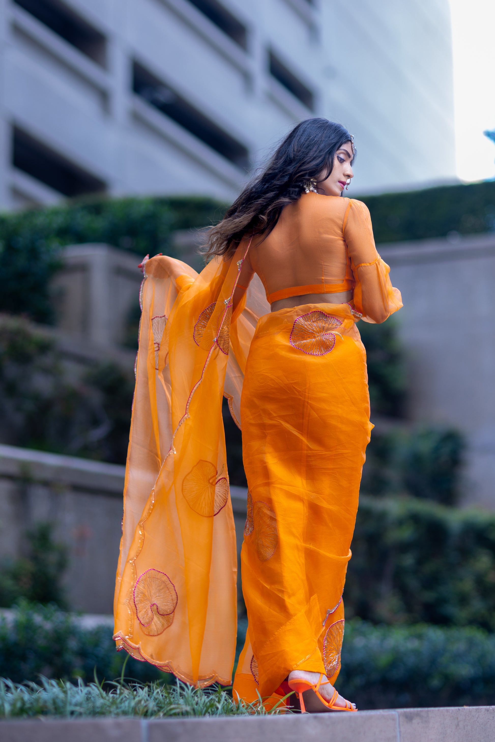 Tamara – Sunkissed Orange Pure Organza Silk Saree with Hand-Embroidered Lotus Leaves & Sequin Pallu