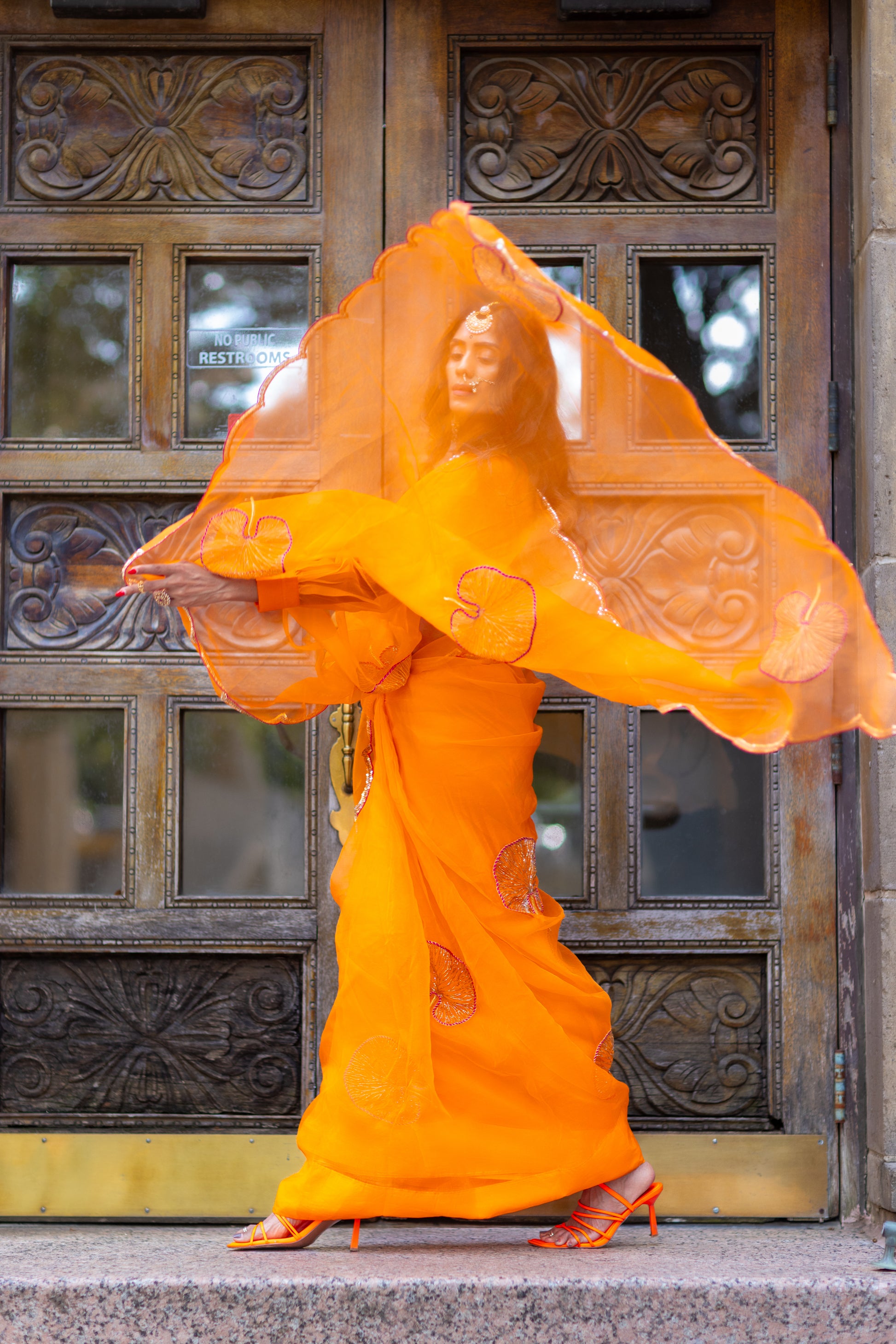 Tamara – Sunkissed Orange Pure Organza Silk Saree with Hand-Embroidered Lotus Leaves & Sequin Pallu