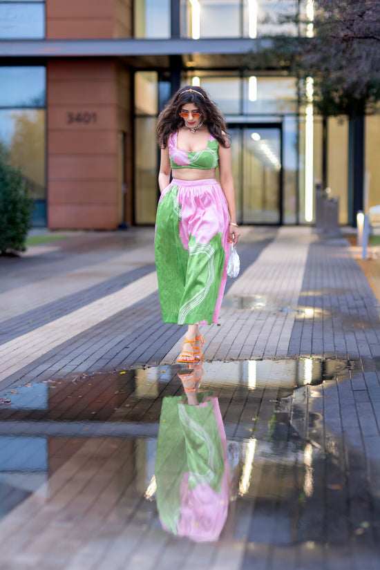 wild petal raw-silk abstract midi skirt in pink and green with A-line silhouette, styled in an urban setting