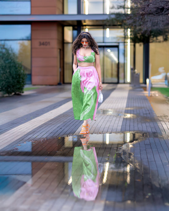wild petal raw-silk abstract midi skirt in pink and green with A-line silhouette, styled in an urban setting